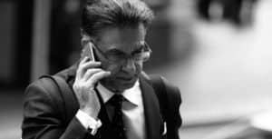 criminal lawyer Manny Conditsis on the phone
