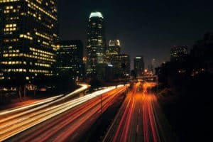 city lights and buildings with traffic lights speed up